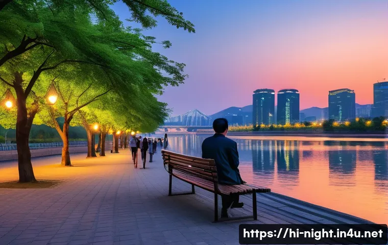 한강 야경 명소 - A serene evening scene by the Han River featuring a calm riverbank with gentle rippling water reflec...
