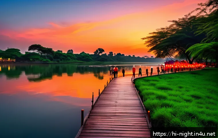 야경이 아름다운 강변 산책로 - A serene riverside evening scene during sunset with a vibrant red and orange sky reflecting on calm ...